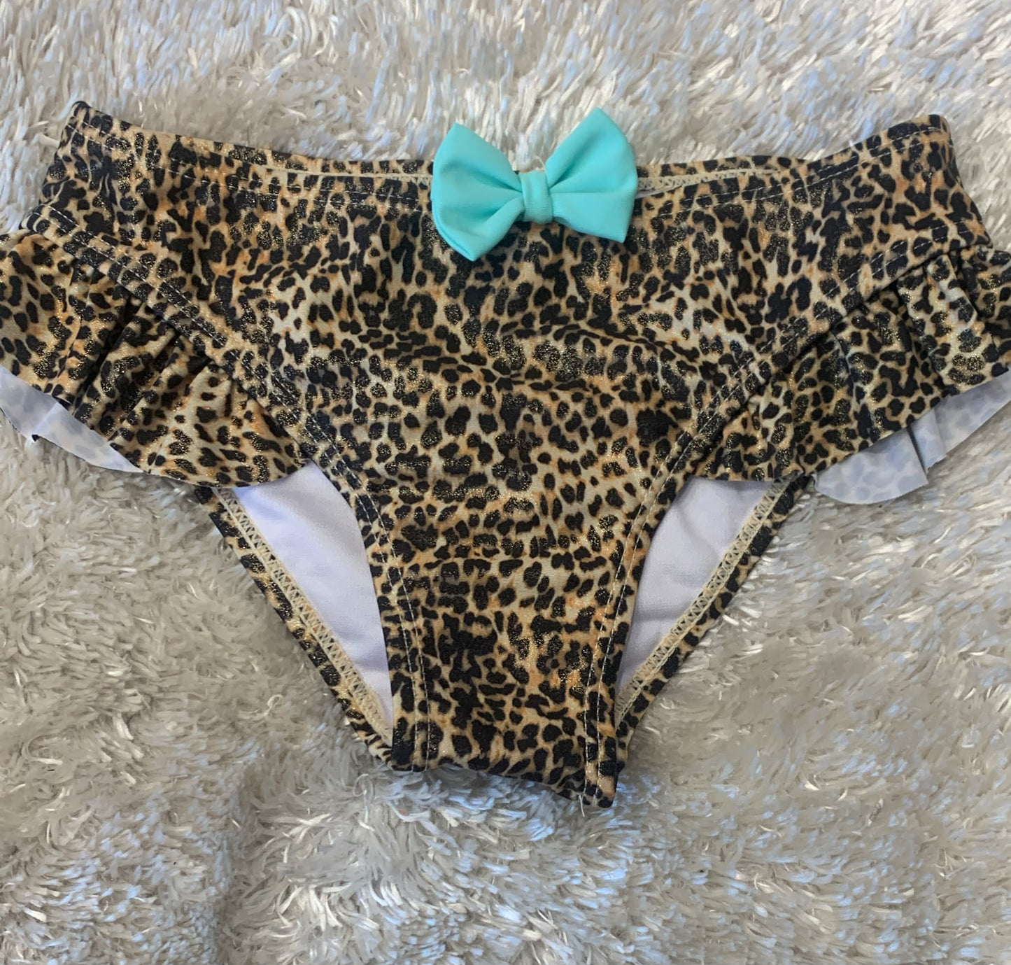 costume slip bimba  con fiocco in rilievo  fantasia leopardata ( l'articolo non può essere cambiato )